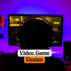 Theoretical interactive media and software development training banner featuring a professional game designer working at a dual-monitor workstation.