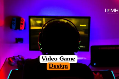 Theoretical interactive media and software development training banner featuring a professional game designer working at a dual-monitor workstation.