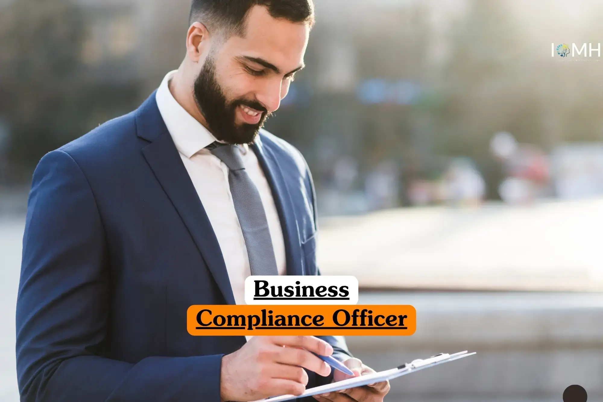 Business Compliance Officer course banner with professional in dark blue suit white shirt and grey tie holding clipboard and pen outdoors with blurred background structures.