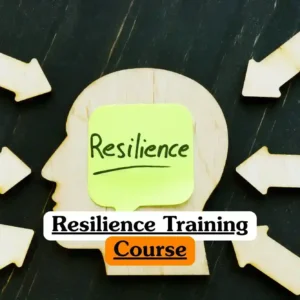 Resilience Training Course banner with wooden cutout human head green sticky note resilience surrounded by wooden arrows pointing inward text resilience training online highlighted orange personal development mental strength training concept.