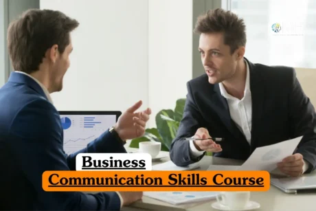 Business Communication Skills course banner with professionals discussing documents and laptop charts in office setting.