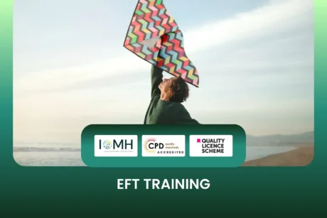EFT Training course banner with person flying colourful kite on beach.