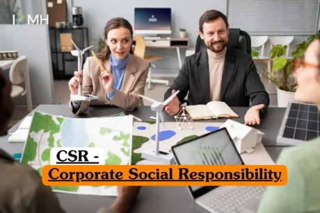Corporate Social Responsibility course banner with professionals discussing renewable energy models including wind turbines and solar panel in office setting.
