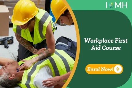 First aid response in a warehouse; banner promotes IOMH Workplace First Aid Course.