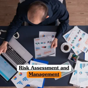 Risk Assessment and Management course banner with person at desk using laptop and tablet analyzing documents charts and graphs with coffee cup telephone and plant in professional workspace.