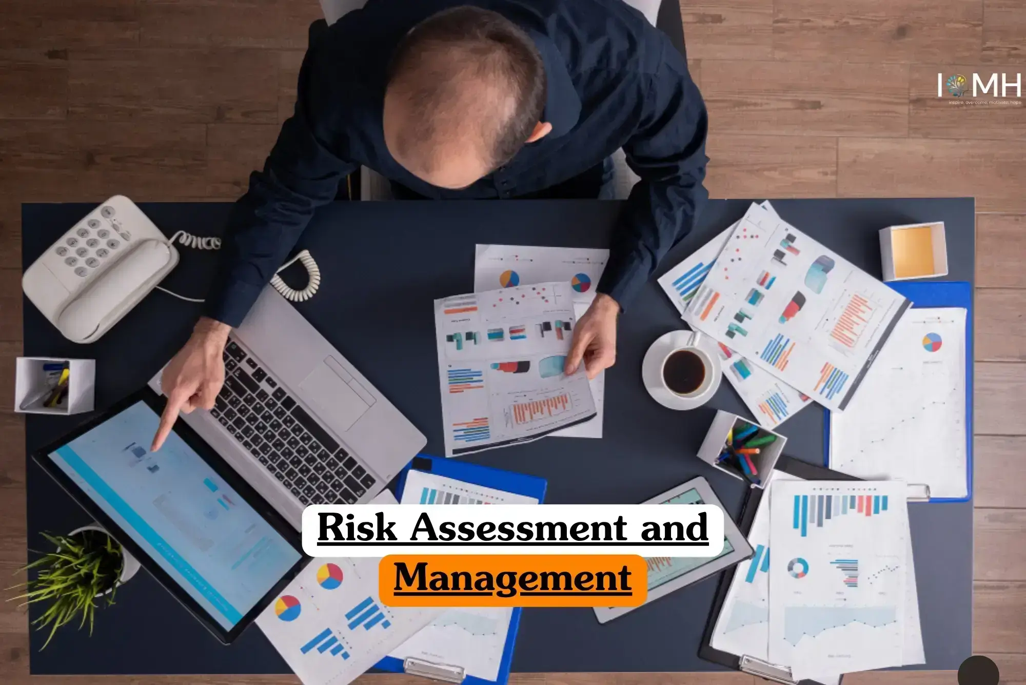 Risk Assessment and Management course banner with person at desk using laptop and tablet analyzing documents charts and graphs with coffee cup telephone and plant in professional workspace.