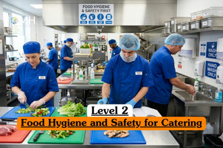 Level 2 Food Hygiene and Safety for Catering course banner with kitchen staff in uniforms preparing food at stainless steel workstations with hygiene signs.