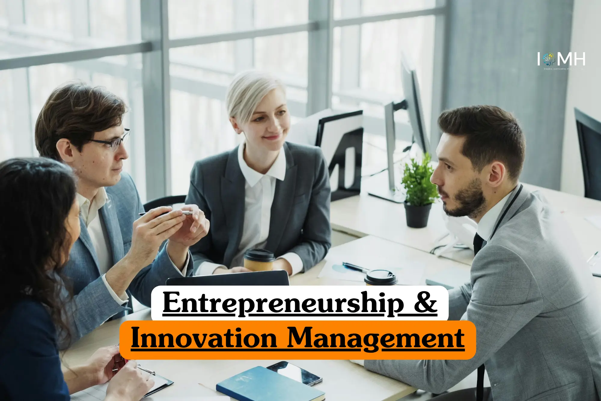 Entrepreneurship & Innovation Management course image showing a collaborative business meeting.
