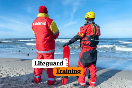 Theoretical aquatic rescue and emergency first response training banner featuring a scenic, bright blue outdoor swimming pool on a clear, sunny day.