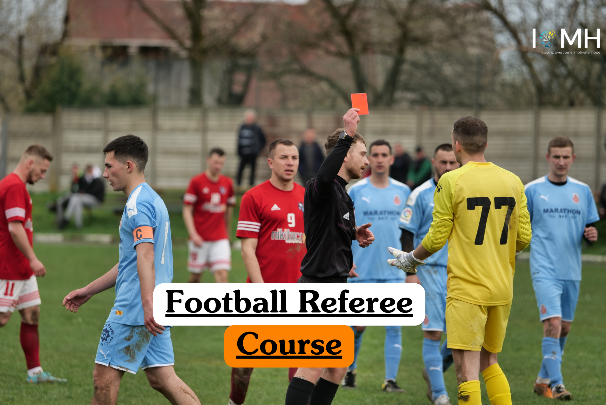 A football referee holding up a red card during a match to illustrate the theoretical principles of officiating, sports rules, and fair play in a Football Referee Course.