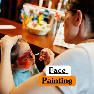 Creative arts and childcare training banner featuring a close-up of a child's face decorated with a colorful butterfly face paint design, using vibrant blue, pink, and orange glitter pigments.