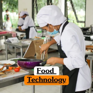 Theoretical food science and production management training banner featuring several students in white chef uniforms, hairnets, and face masks working at stainless steel stations in a large commercial kitchen environment.