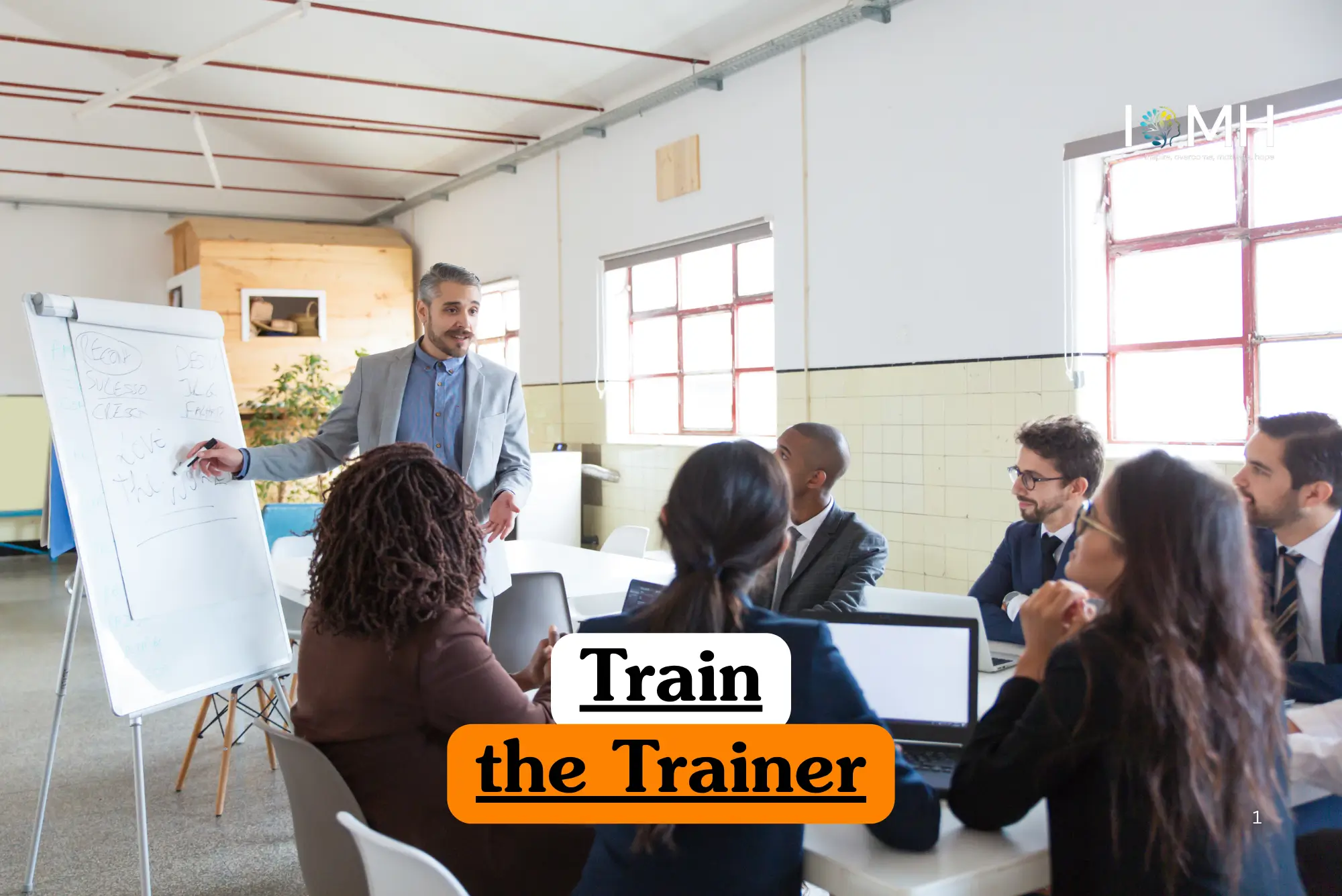Corporate education training banner featuring a male instructor in a grey blazer writing on a whiteboard while leading a professional workshop for a diverse group of adults in a bright office.