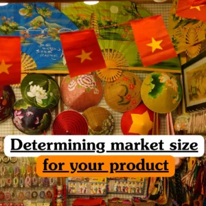 Theoretical marketing and business strategy training banner featuring a vibrant market stall in Vietnam, adorned with traditional hand-painted conical hats (Non La), decorative fans, and Vietnamese flags, representing the study of total addressable market (TAM), market segmentation, consumer demand analysis, and global trade opportunities.