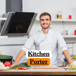 Theoretical hospitality and food safety training banner featuring a smiling young male chef in a white professional tunic standing behind a wooden prep station in a bright, modern commercial kitchen.