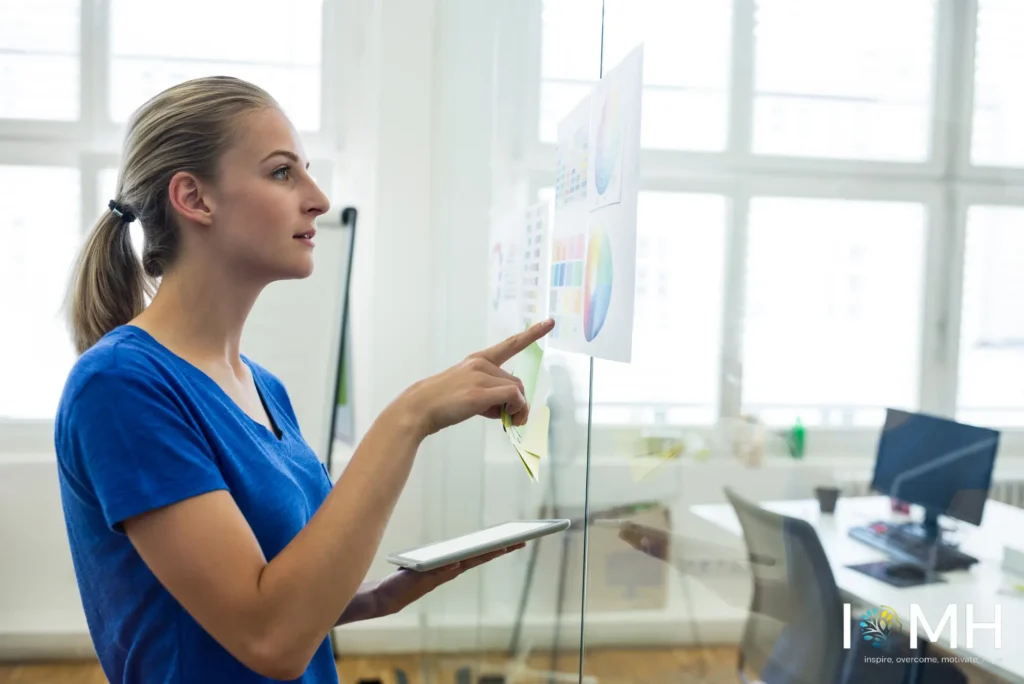 An instructional designer or healthcare education professional reviewing multimedia assets, color schemes, and digital learning modules for a curriculum framework.