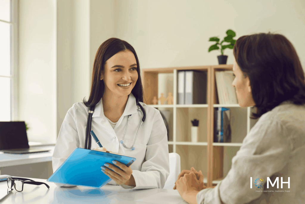 Smiling oral health practitioner discussing care options with a patient during a consultation appointment
