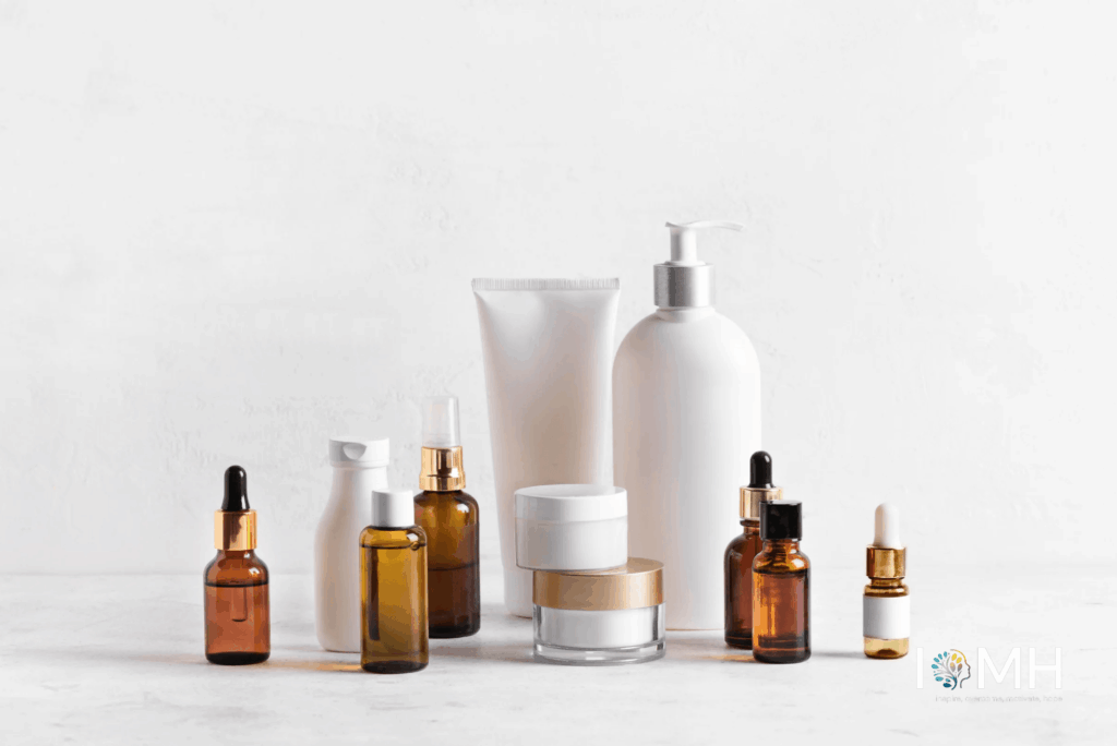 Collection of skincare bottles, serums, moisturizers, and dropper jars displayed on a white marble surface