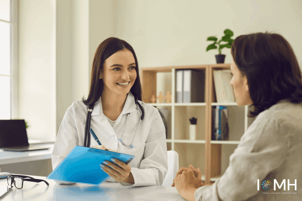 Smiling female doctor with clipboard consulting a patient in a bright clinic – expert pregnancy care advice and prenatal consultation recommended by UK specialists