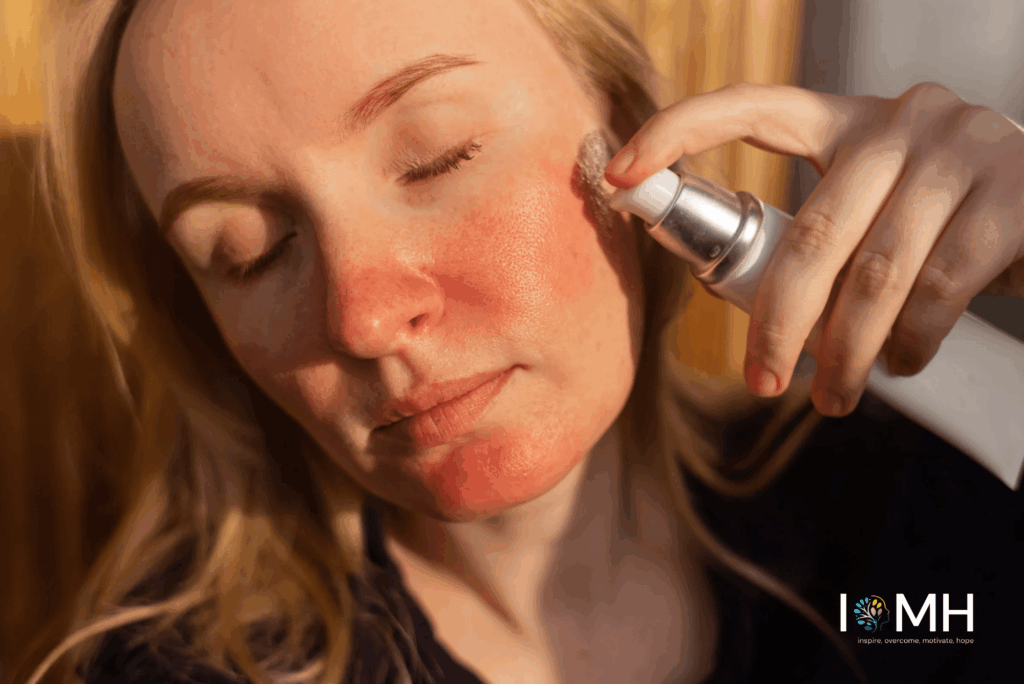 Woman with sensitive, red skin gently applying a calming skincare product to her cheek
